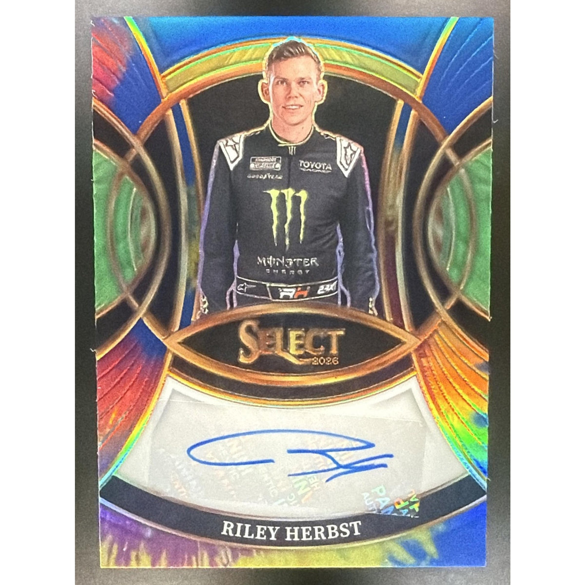 2026 Panini Select NASCAR Riley Herbst #S-RHB Signatures Tie-Dye Prizms /25 Auto