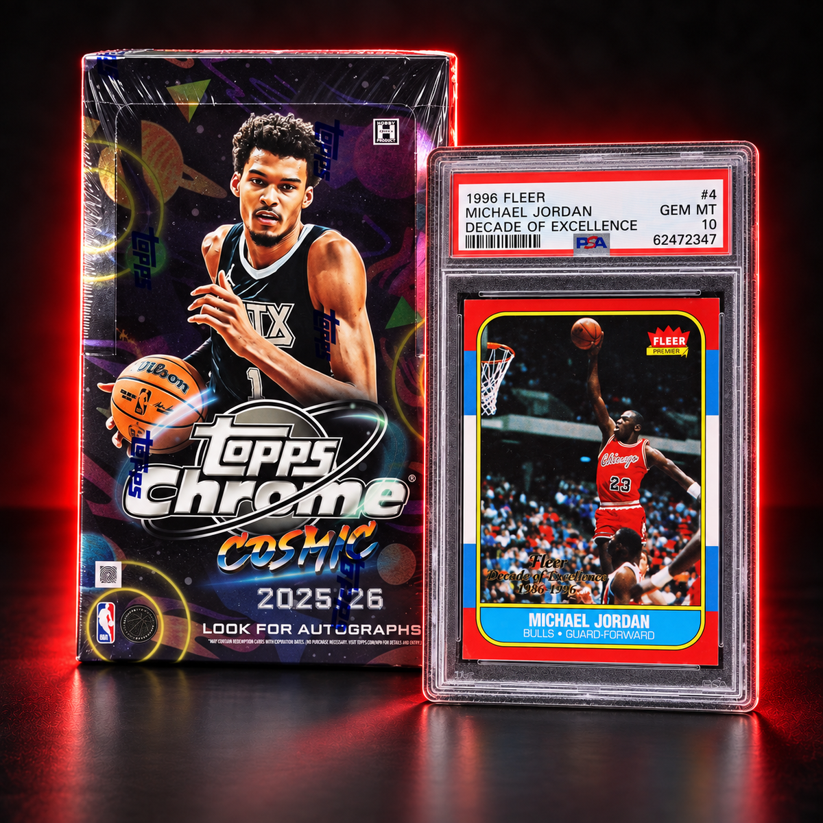 A sealed 2025 Topps Chrome Coasters trading card box stands beside a graded 1996 Fleer Michael Jordan card in a clear plastic holder, photographed on a dark reflective surface with red lighting.