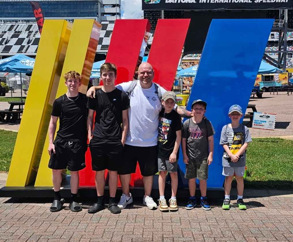 Dan and his children at Daytona International Speedway